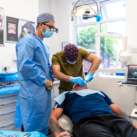 Two clinicians treating a patient together
