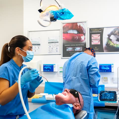 A dental nurse assisting during treatment