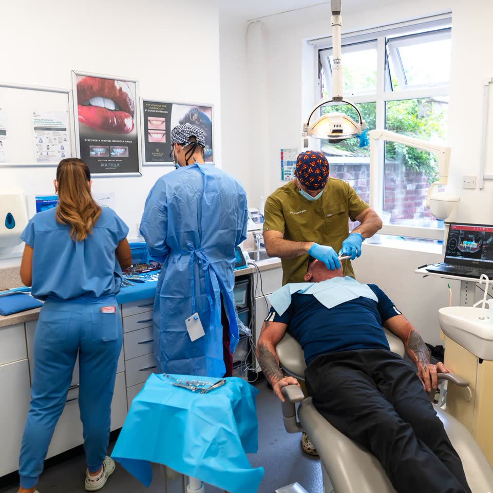 The Astley team treating a patient in a bright treatment room