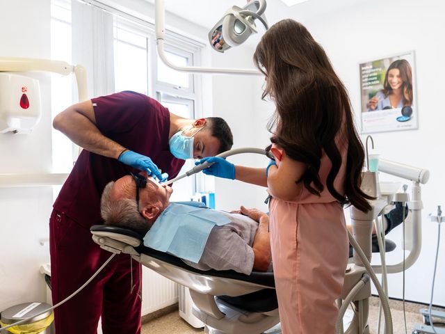 A dentist and dental nurse giving a patient a check-up