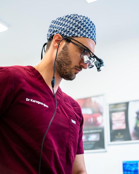 Dr George Karageorgiou in surgical loupes